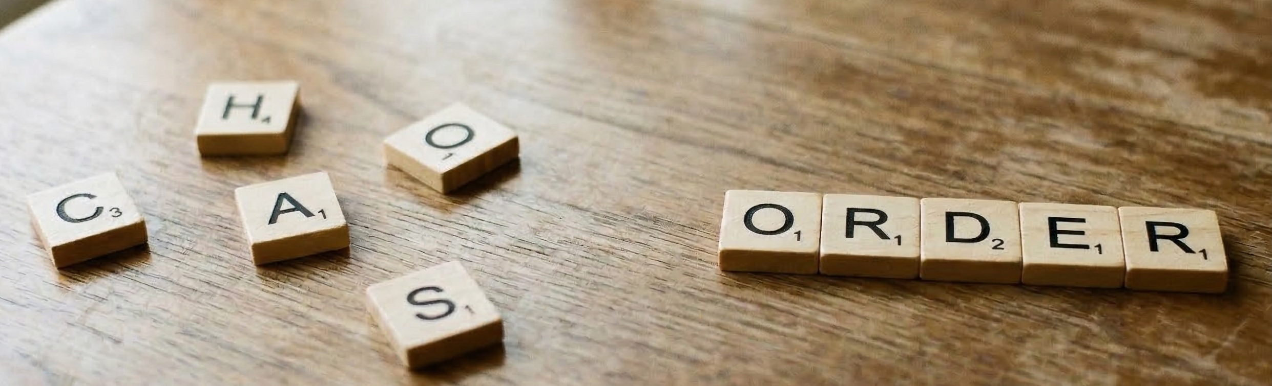 Wooden tiles spelling order and chaos